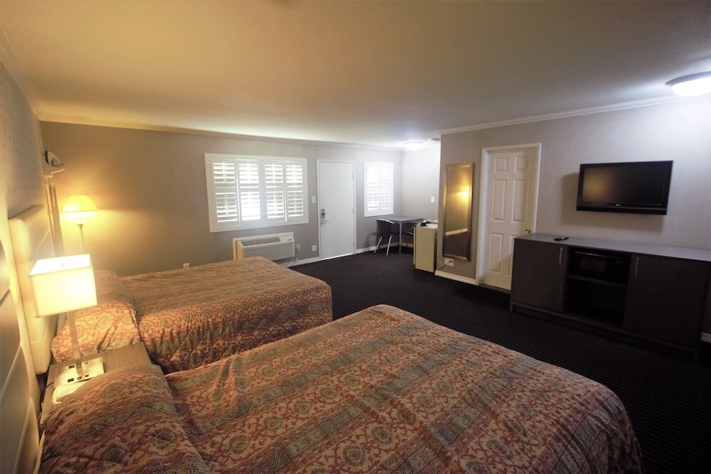 Standard quadruple chambre Alpha Inn and Suites