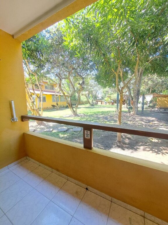Habitación cuádruple Estándar con balcón y con vista al jardín Pousada Beach Bahia