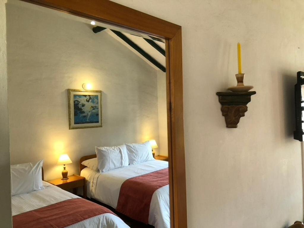 Четырёхместный номер Superior с красивым видом из окна Hotel Hospederia San Carlos Villa De Leyva
