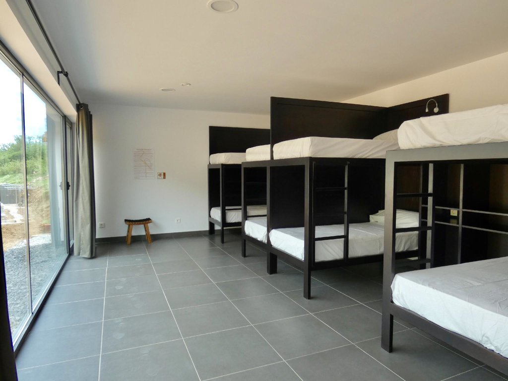 Кровать в общем номере Albergue Casa Sueño