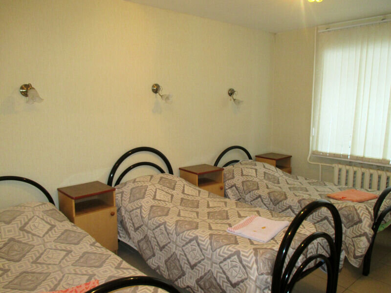 Кровать в общем номере Гостиница Виктория