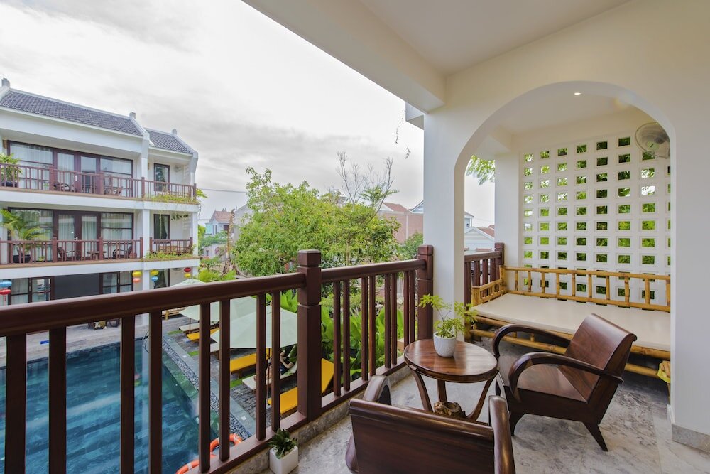 Standard Triple Family room with balcony and with garden view Louis Villa Hoi An