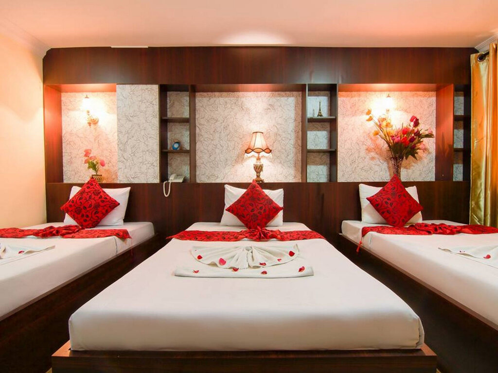 Кровать в общем номере Angkor Mithona Guesthouse