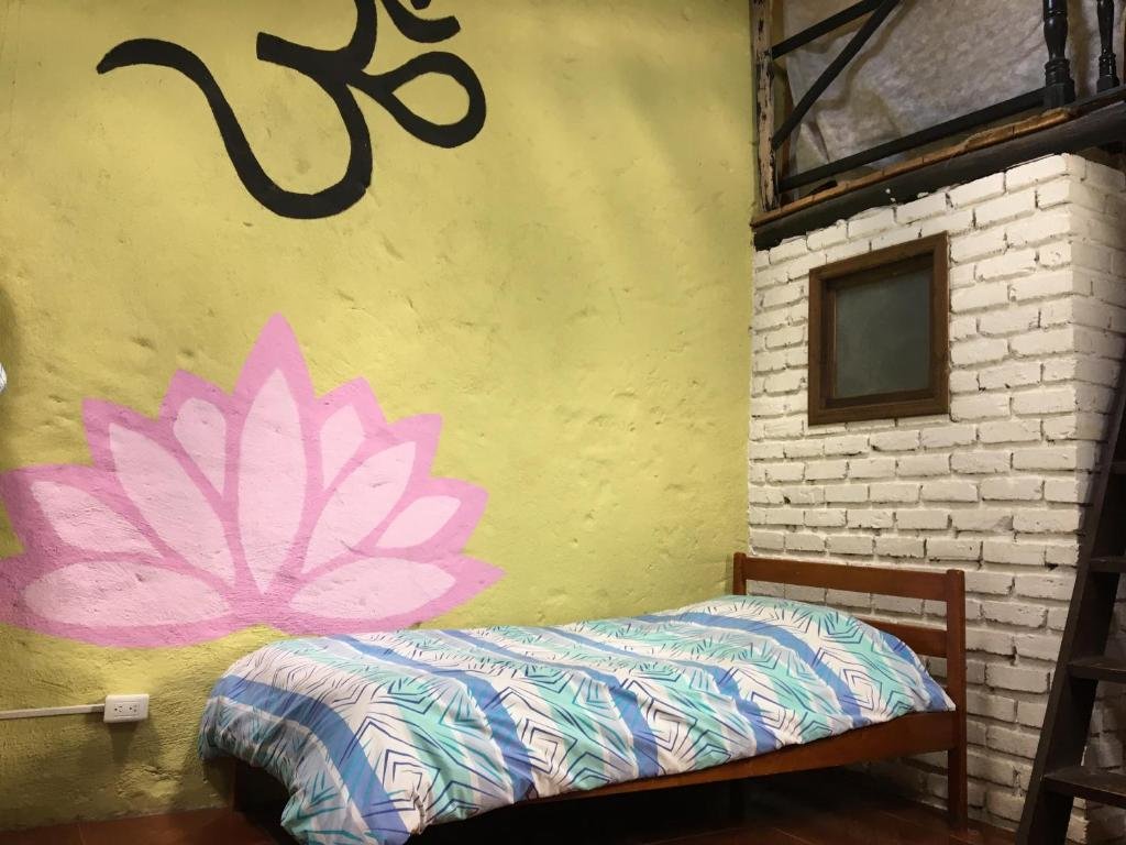 Кровать в общем номере Finca San Pedro