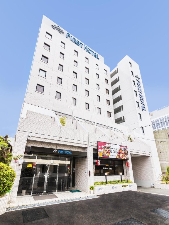 Кровать в общем номере Kanku Izumisano First Hotel