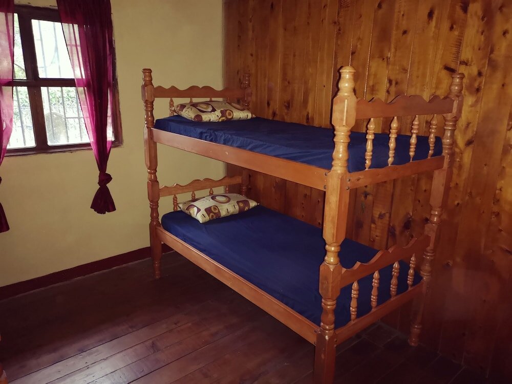 Кровать в общем номере Casa Mirella