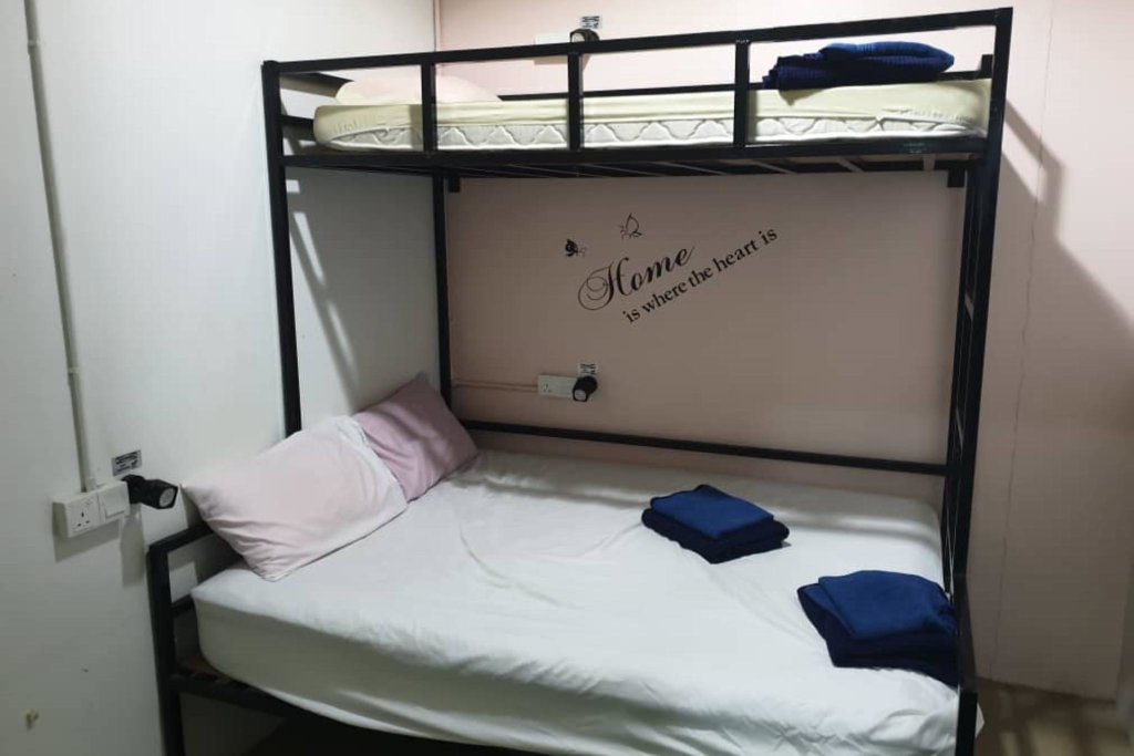 Кровать в общем номере SPOT ON 90277 Dongfang Motel
