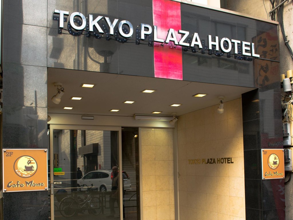 Кровать в общем номере Tokyo Plaza Hotel