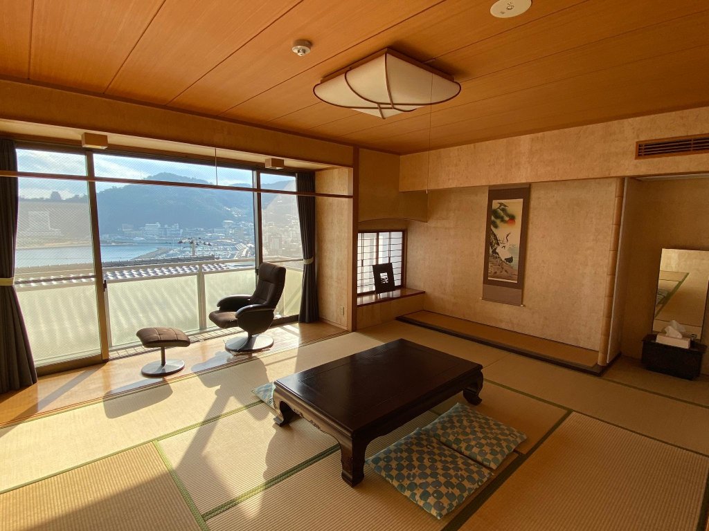 Кровать в общем номере Atami Onsen Guest House Megumi