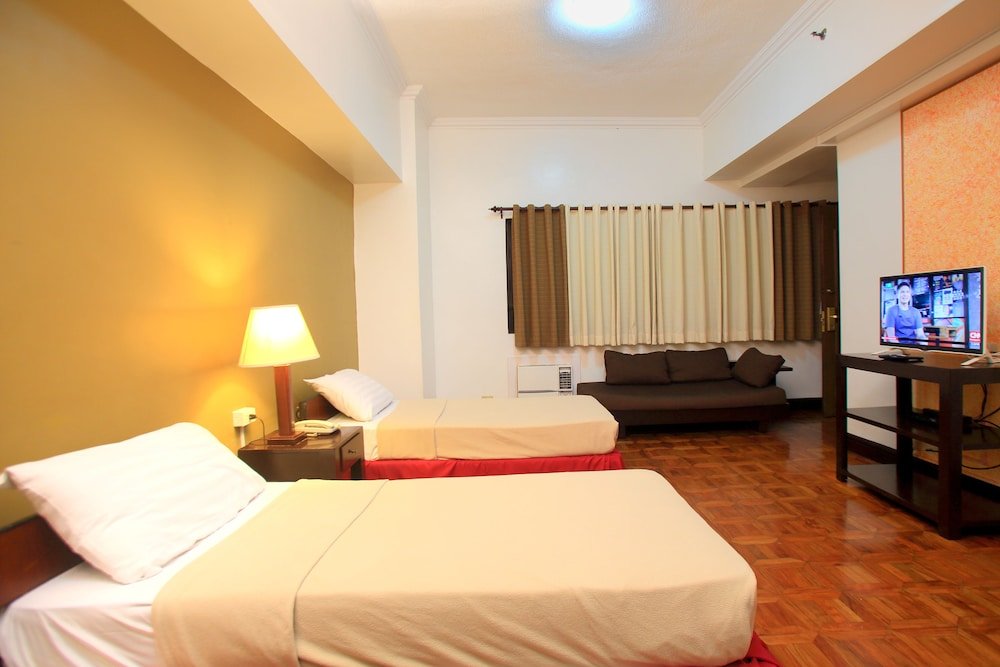 Habitación triple Premier 1 dormitorio BSA Suites Makati