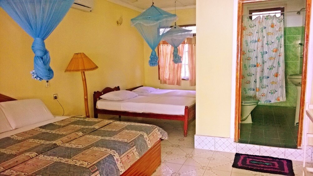 Standard quadruple chambre 1 chambre Vue jardin Sigiri Holiday Inn