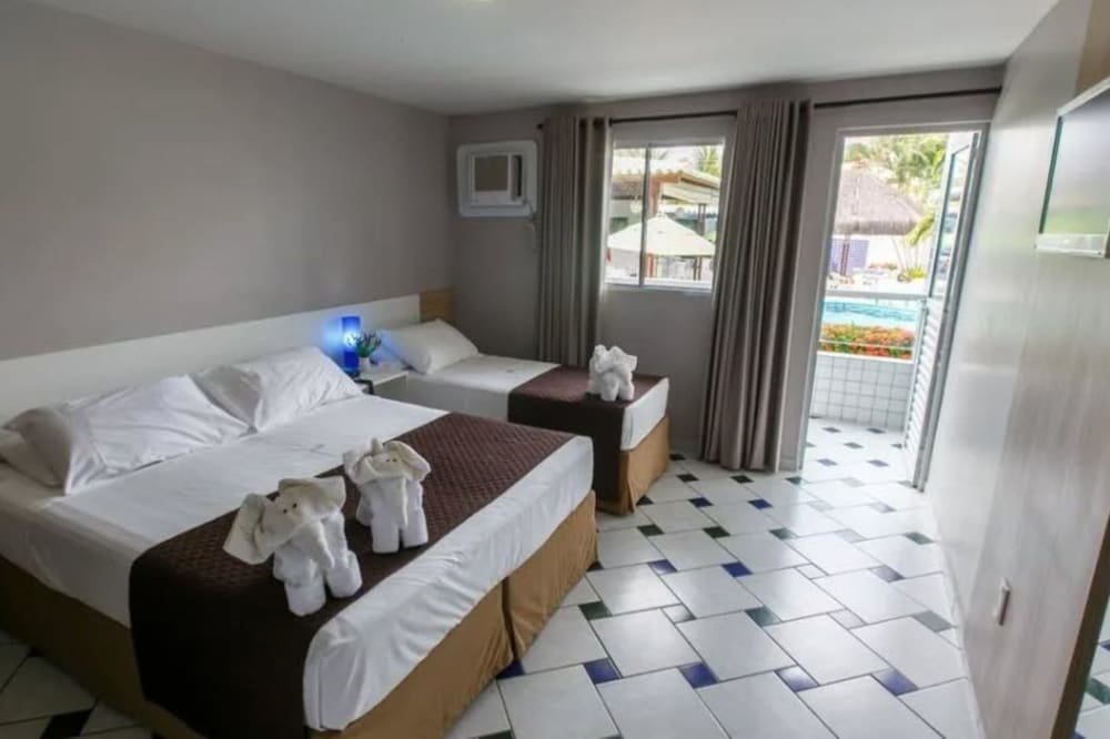 Habitación triple De lujo con balcón Hotel Enseada dos Corais