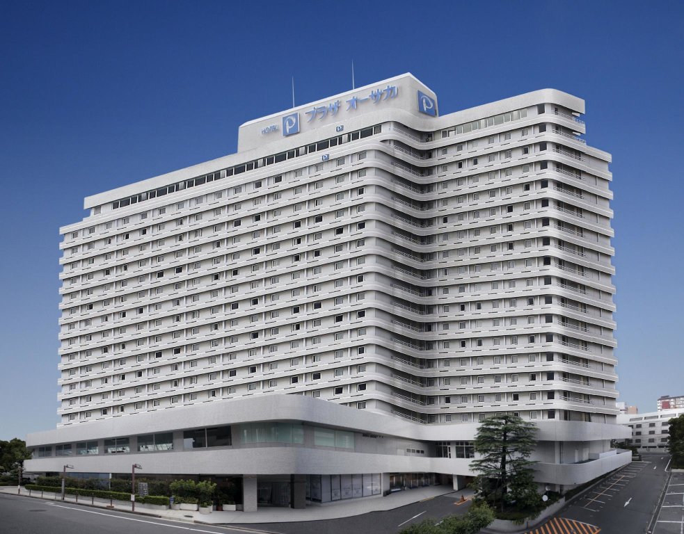 Кровать в общем номере Hotel Plaza Osaka