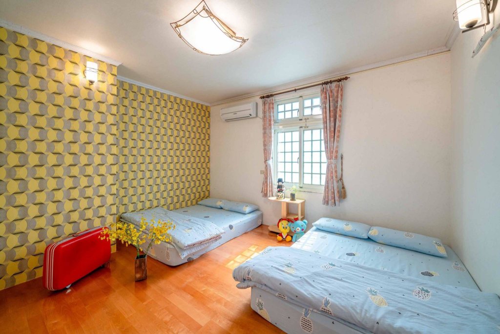 Кровать в общем номере Yilan Real Fun Homestay