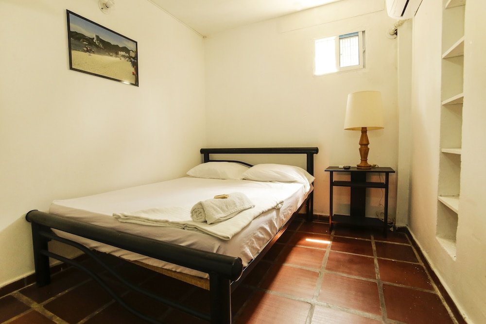 Кровать в общем номере Hotel Mirador de Taganga