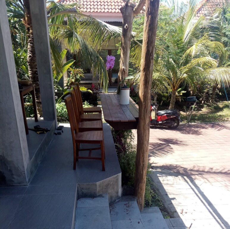 Бунгало Deluxe с балконом и с видом на сад Pier26 Bali Homestay