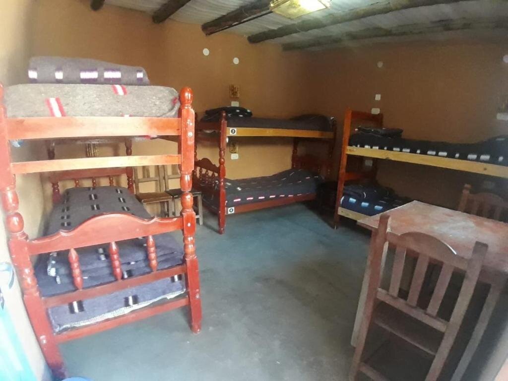 Кровать в общем номере Giramundo Hostel Purmamarca