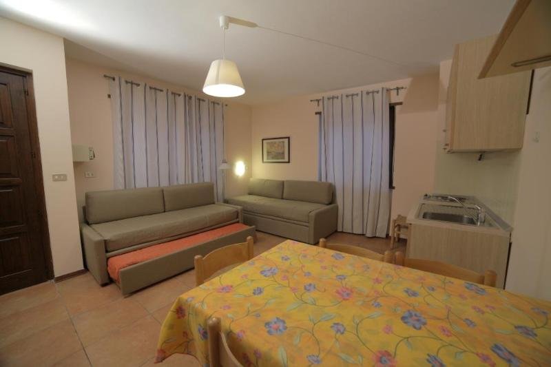 Кровать в общем номере с 3 комнатами Residence Villa Linda