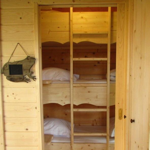 Cama en dormitorio compartido Les Cabanes Dans Les Bois