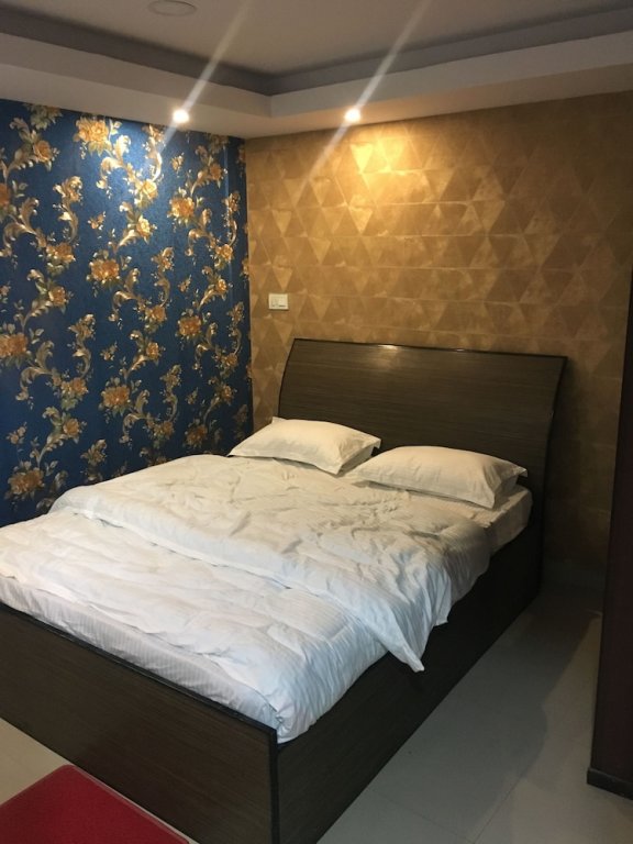 Кровать в общем номере Ignite Hotel And Restaurant