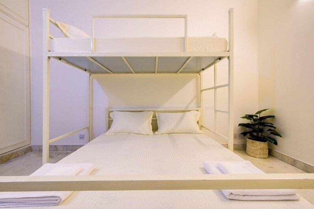 Cama en dormitorio compartido 3 habitaciones Bienvenue Stays - Hostel