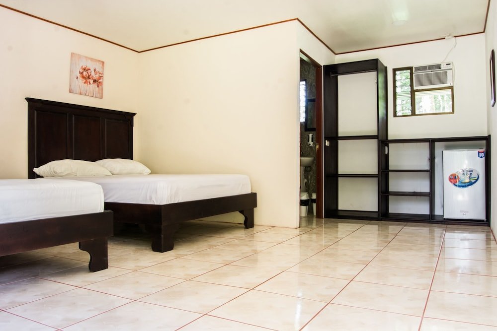 Standard Quadruple room with garden view Hotel Lavas del Arenal