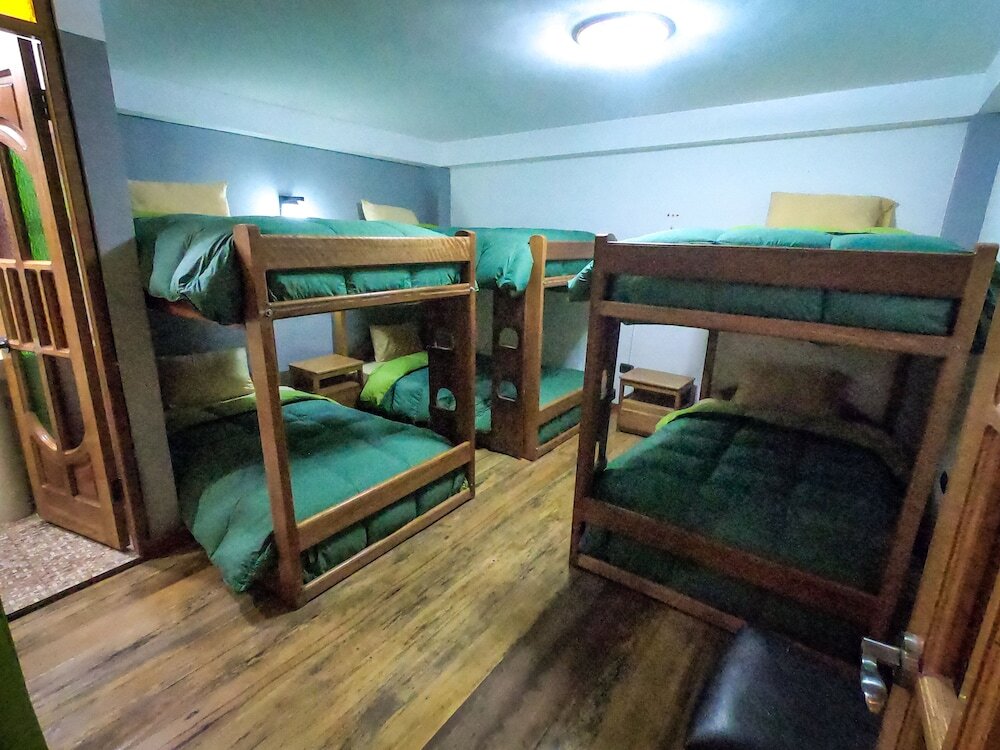 Кровать в общем номере Hotel Inka King
