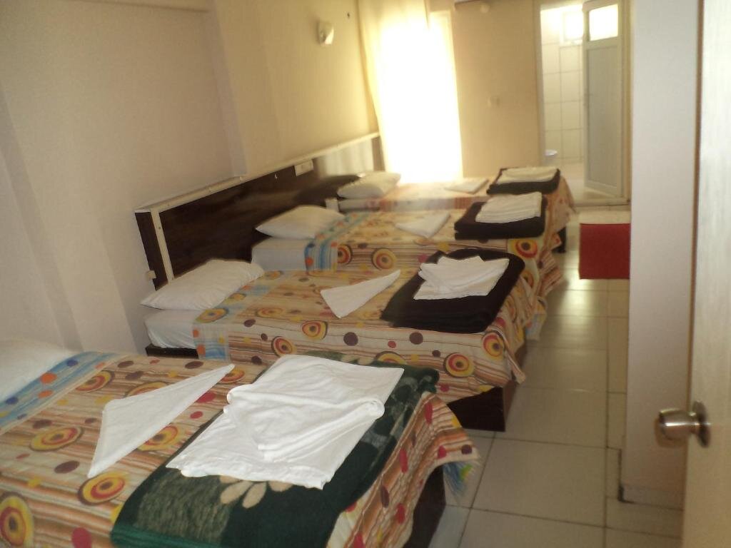 Кровать в общем номере Anatolia Hotel