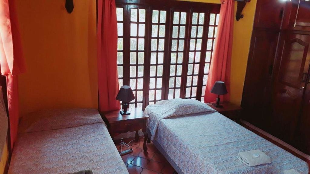 Кровать в общем номере Casa Inti Guesthouse & Lodge