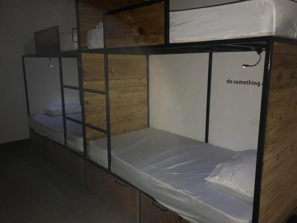Кровать в общем номере El Caite Hostel