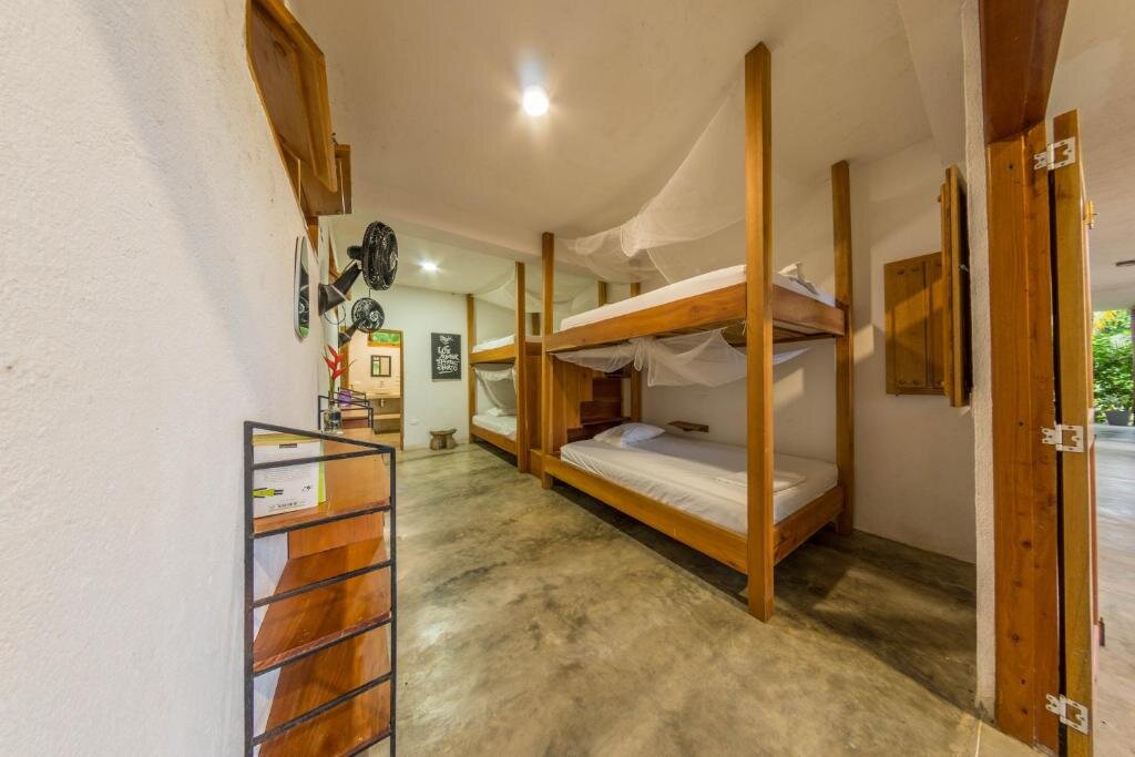 Кровать в общем номере Casa Chapolin Boutique Guesthouse