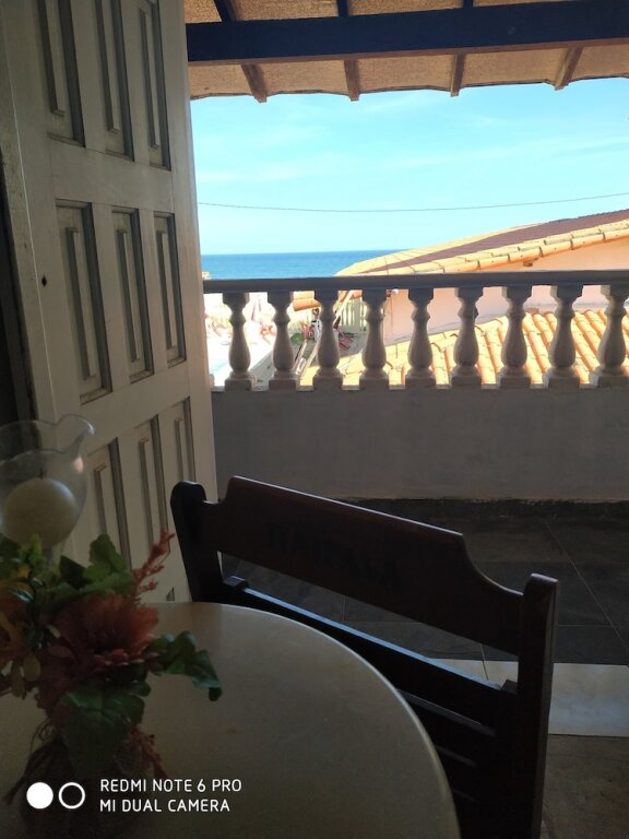 Habitación triple Estándar ático con balcón y con vista al mar POUSADA CARIBE CARIOCA
