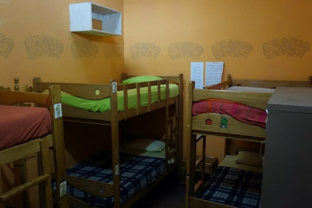 Кровать в общем номере Kaminu Backpackers Hostel