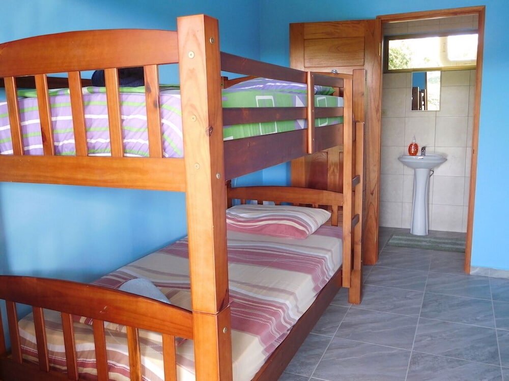 Кровать в общем номере Hostal Casa Las Lajas