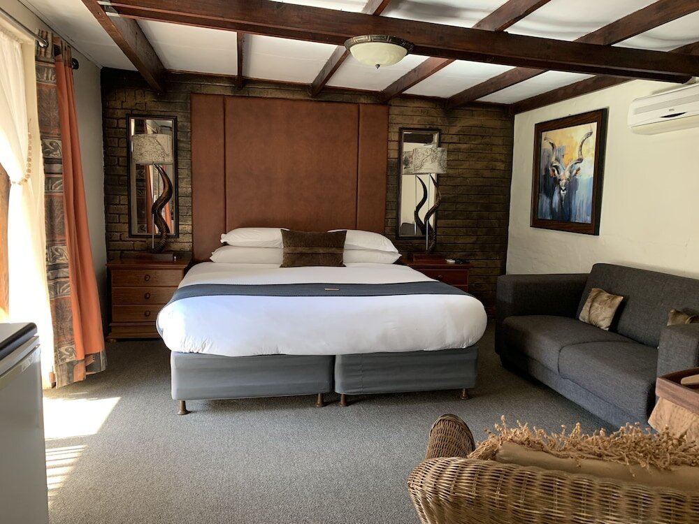 Executive Zimmer Ama Zulu Guesthouse & Safaris