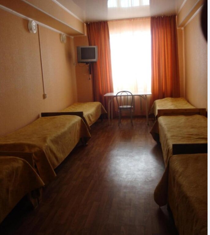 Кровать в общем номере Гостиница Солнечная