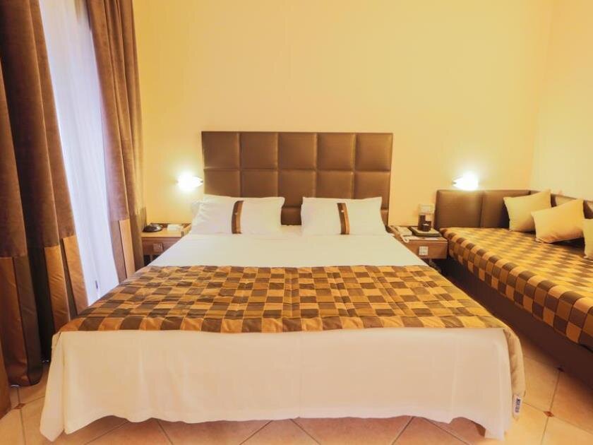 Кровать в общем номере Best Western Hotel Libertà