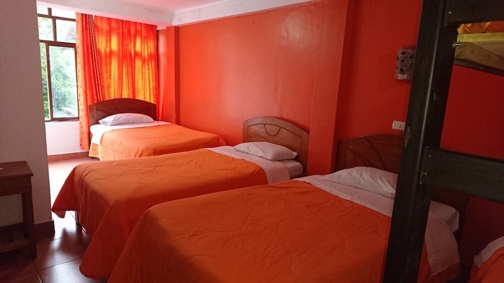 Standard quadruple chambre avec balcon Amaru inn
