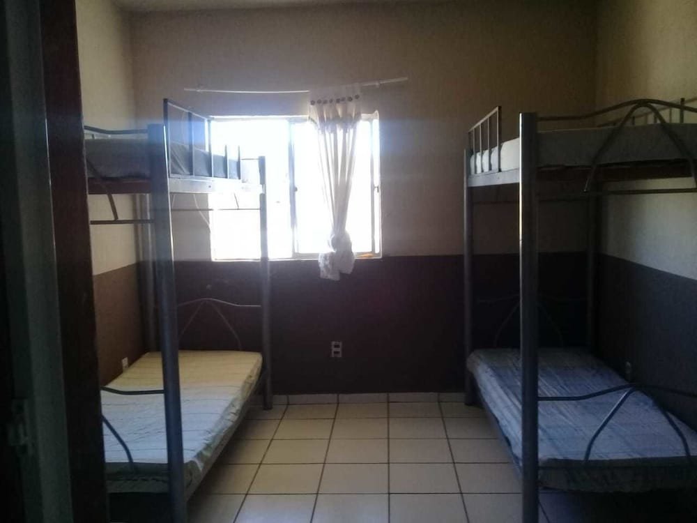 Cama en dormitorio compartido Alojamento PBH - Hostel