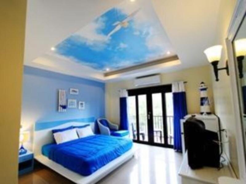Кровать в общем номере Coco Nori @ Sea Resort