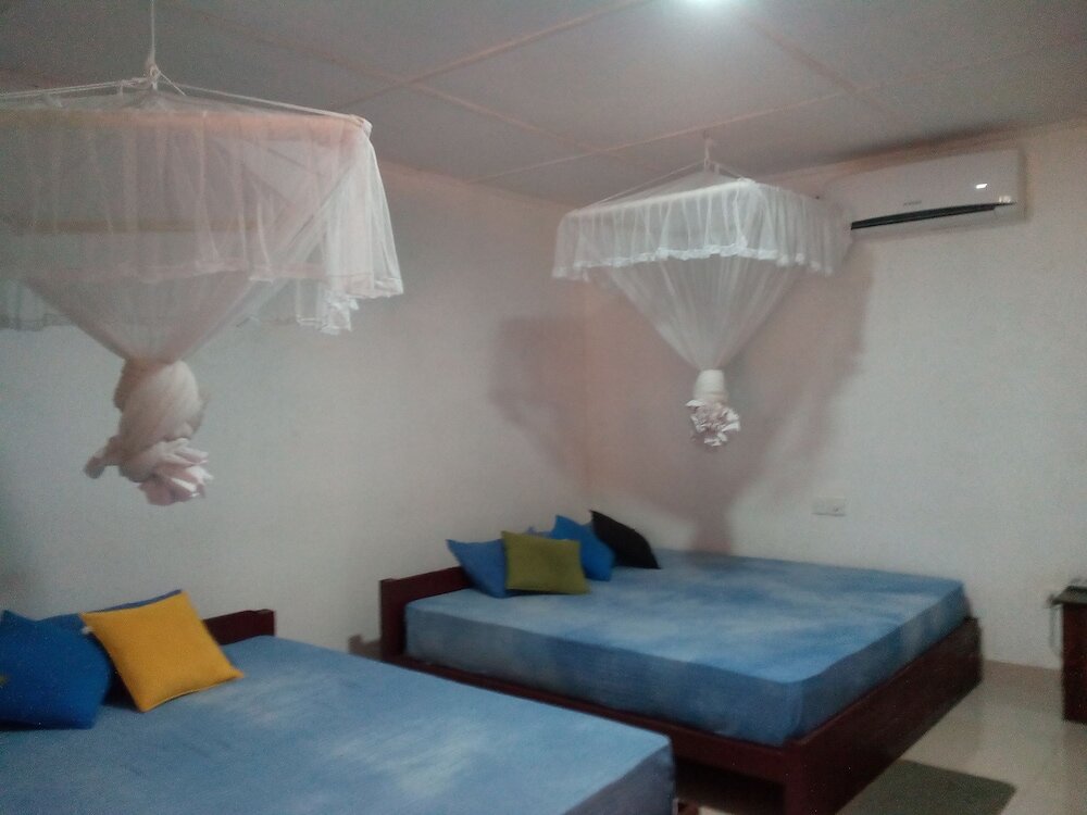 Cama en dormitorio compartido walawwa home stay