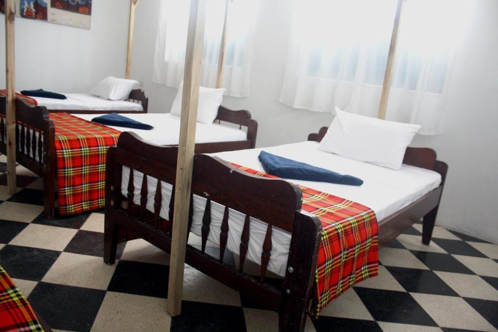 Кровать в общем номере Kimte Beach Lodge