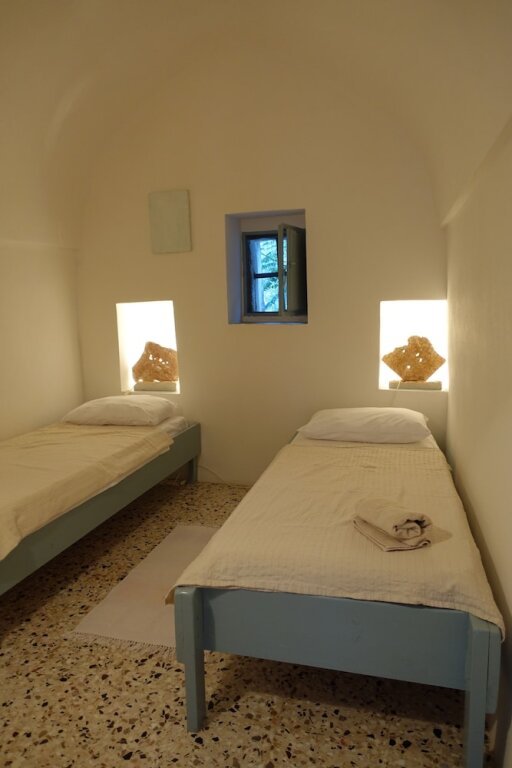 Suite 1 dormitorio con vista al mar Borgo Fiancoafianco