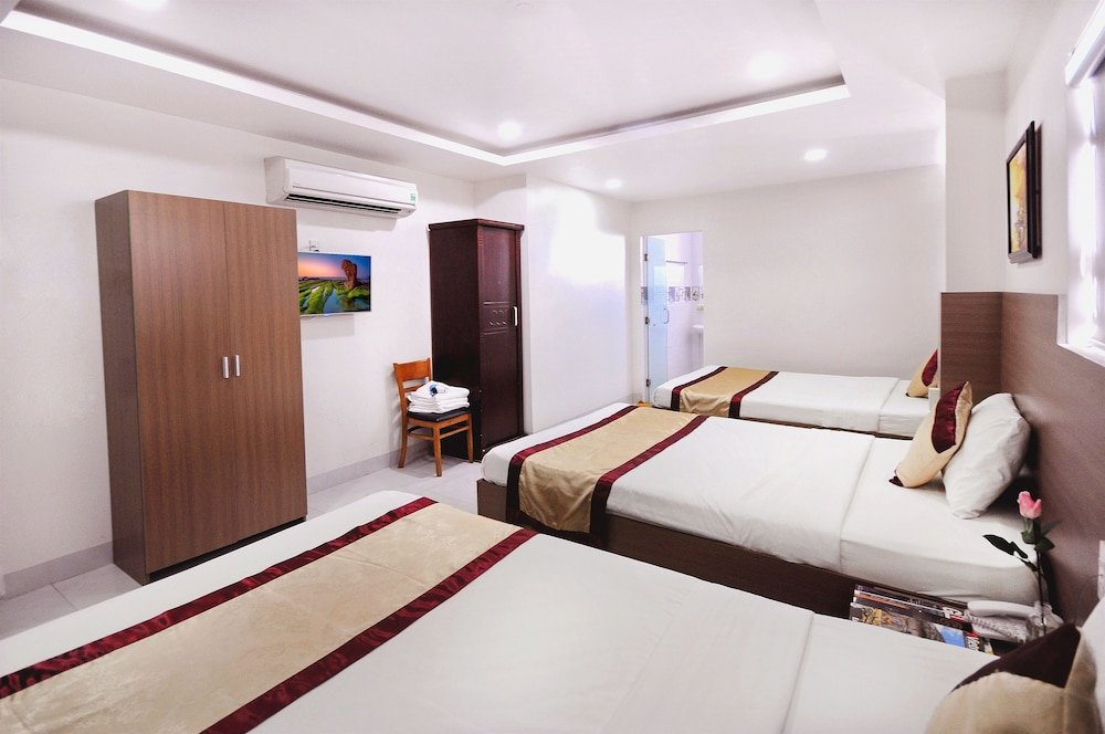 Кровать в общем номере Arise Seaside Hotel