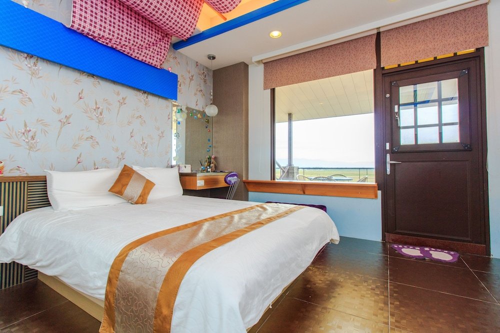 Standard quadruple chambre avec balcon et Vue sur l'océan LANYANGbnb