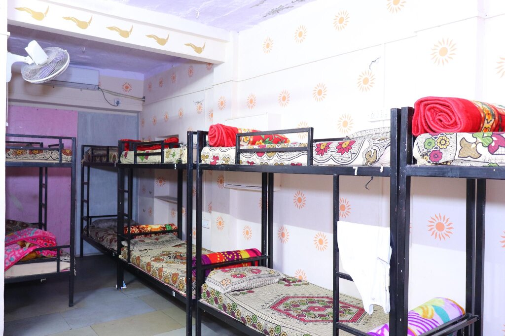 Кровать в общем номере Jamna Vilas Guest House