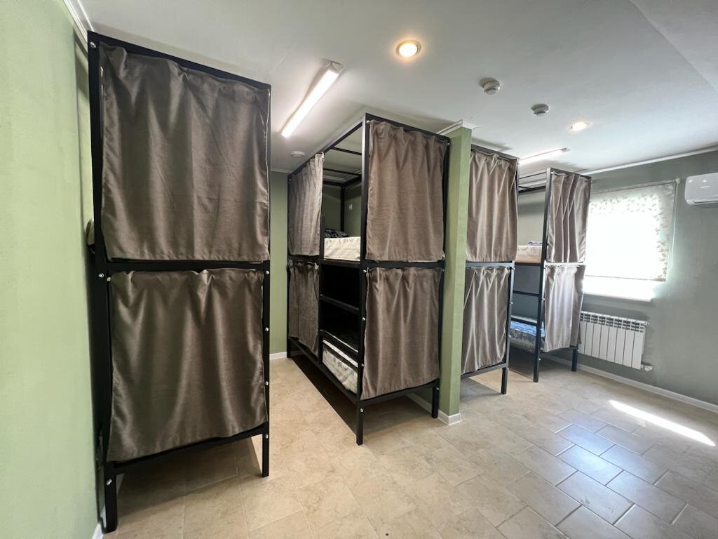 Cama en dormitorio compartido Aris Mini Hotel
