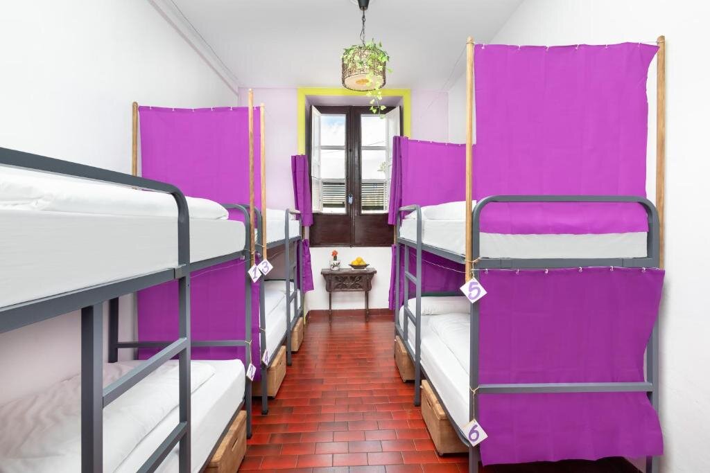 Кровать в общем номере Patio Hostel