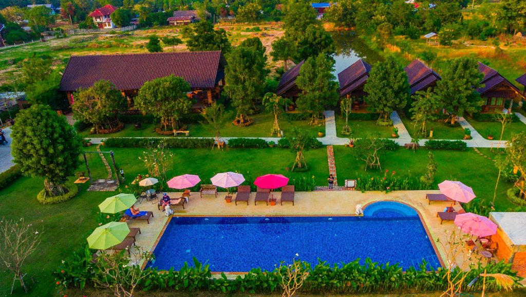 Кровать в общем номере Sawasdee Sukhothai Resort