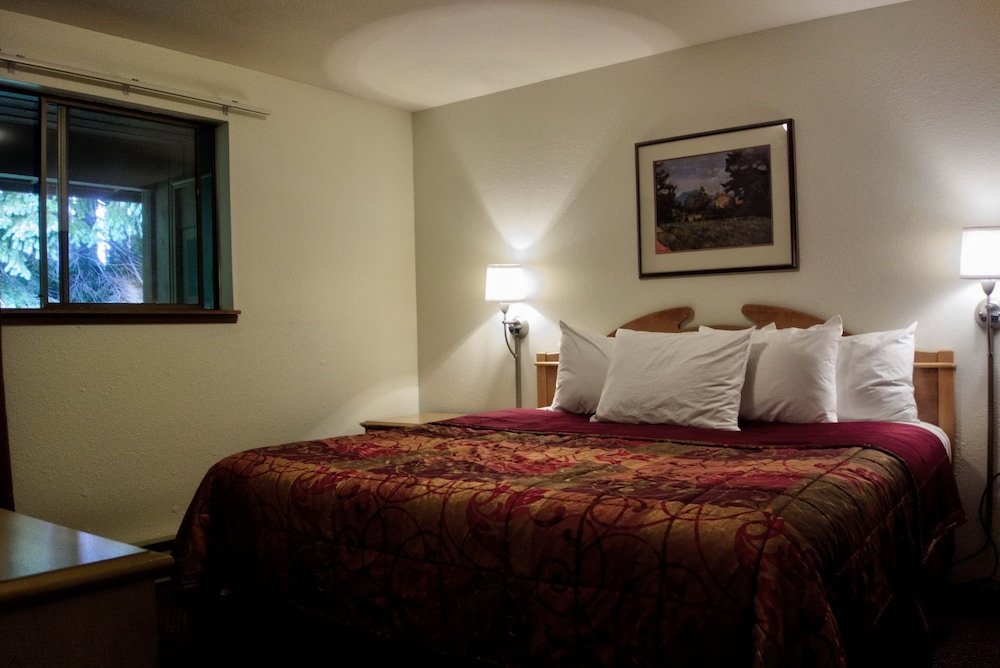 Suite doble Premium 1 dormitorio con balcón y con vista al jardín Olympic Suites Inn